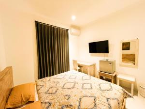 TV a/nebo společenská místnost v ubytování Alita Hotel Sanur