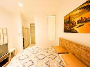 Postel nebo postele na pokoji v ubytování Alita Hotel Sanur + 19 fotografií