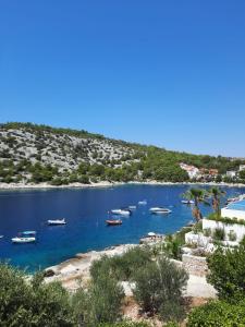 a group of boats in a body of water at Apartman Val in Rogoznica