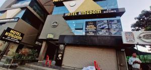 a building with a large sign on the side of it at Hotel Kingdom in Gandhinagar