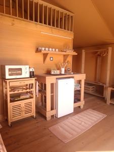 Kuchyň nebo kuchyňský kout v ubytování Glamping Podere Poggiagrilli