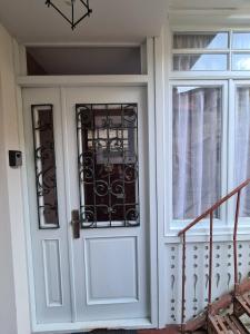 a front door of a house with a window at Cosy Apartment in the heart of old Tbilisi in Tbilisi City