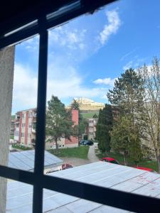 a view of a mountain from a window at Penzión u Kastelána in Spišské Podhradie +18 photos