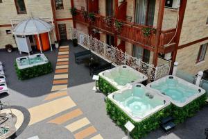 an aerial view of a building with two jacuzzles at Spa Hotel Rich in Velingrad