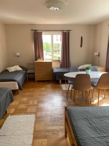 Postel nebo postele na pokoji v ubytování Odensvi Vandrarhem