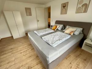 a bed in a room with two pillows on it at Ferienwohnung für 5 Personen in Dresden