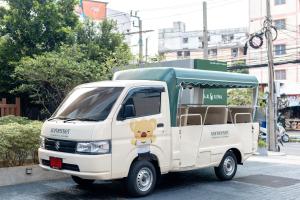 a small white truck with a teddy bear on the side at Somerset Sukhumvit 71 Bangkok in Bangkok +78 photos