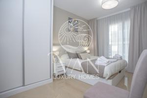 Giường trong phòng chung tại Casa Playera Ivan Luxury Homes 5ªPlta Norte 1ªLinea +14 ảnh