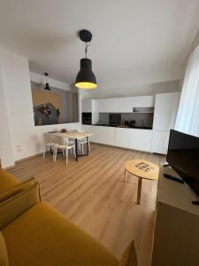 a living room with a couch and a table at Verde Acqua Suite in Lecco