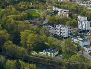 an aerial view of a city with trees and buildings at Przystanek Skarpa in Olsztyn