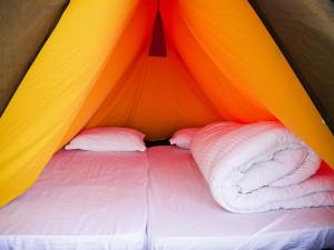 Voodi või voodid majutusasutuse Naya Gaun Eco Resort toas