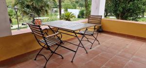 a table and two chairs on a patio at Monte Malk Abran in Vila de Frades