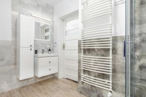 Kúpeľňa v ubytovaní Osiedle Bursztynowe III by Jantar Apartamenty Kołobrzeg + 33 fotografií