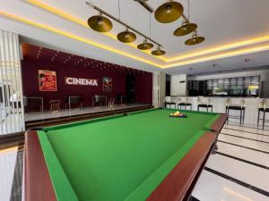 a pool table in a room with a bar at Qoople Excellence apartments by the sea in Alanya +76 photos