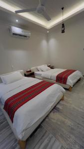 Postel nebo postele na pokoji v ubytování Wadi Al Arbeieen Resort