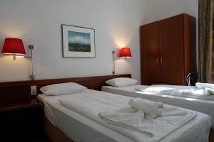 Postel nebo postele na pokoji v ubytování Hotel Xantener Eck