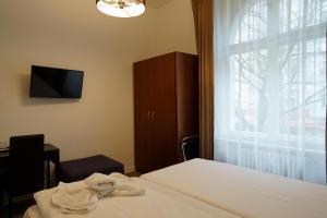 Postel nebo postele na pokoji v ubytování Hotel Xantener Eck
