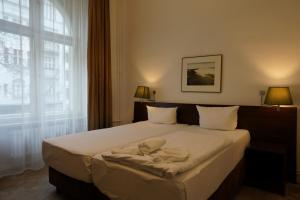 Postel nebo postele na pokoji v ubytování Hotel Xantener Eck