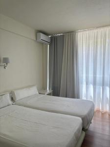 A bed or beds in a room at Hotel La Mota by Punta25 Hotels Group