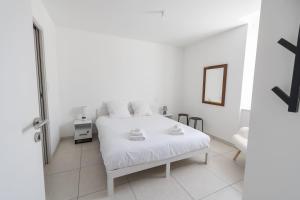 Postel nebo postele na pokoji v ubytování Maison en plein cœur des Sables d'Olonne