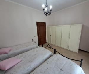 Un pat sau paturi într-o cameră la San Nanni House
