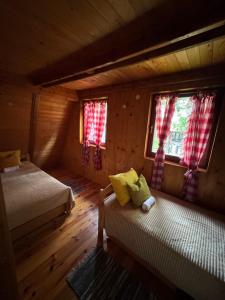 Postel nebo postele na pokoji v ubytování Gružanski Biser