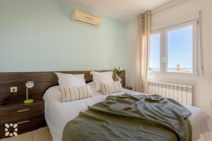 Łóżko lub łóżka w pokoju w obiekcie Villa Gran Sol by Abahana Villas