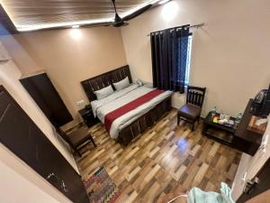 Postel nebo postele na pokoji v ubytování Shreenivas + 14 fotografií