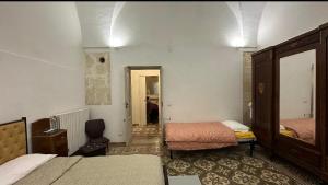 Postel nebo postele na pokoji v ubytování Casa Scarciglia