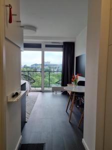 a room with a view of a bedroom and a table at Sleep with the view in Staré Mesto