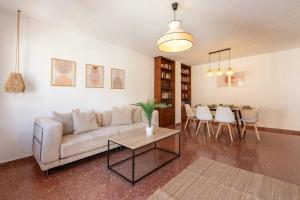 a living room with a couch and a table at Casa Sánchez. Old Town Marbella in Marbella