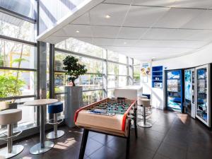 a game room with a foosball table in a store at ibis budget Paris Porte de Vincennes in Paris