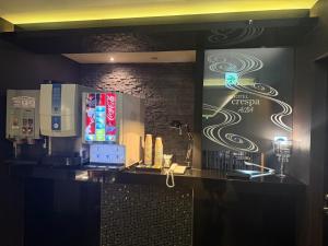 a bar with a sign on the wall of a restaurant at ホテルクレスパアルバ in Shizuoka
