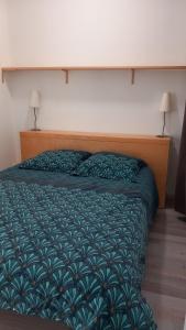 Postel nebo postele na pokoji v ubytování Gite chez Anne So