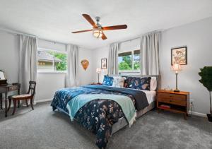 a bedroom with a bed and a ceiling fan at Spacious and Luxury Designed Ranch with Game Room in Strongsville