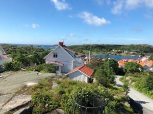 a white house on top of a hill at West coast villa with stunning ocean view ! in Hovenäset