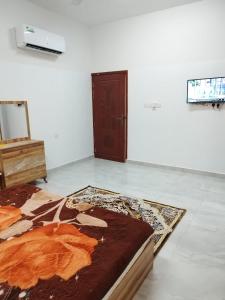 TV a/nebo společenská místnost v ubytování غرف للإيجار اليومي