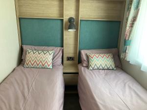 Voodi või voodid majutusasutuse Paradise Palms - 35 Lancaster Crescent toas