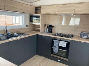 Köök või kööginurk majutusasutuses Paradise Palms - 35 Lancaster Crescent