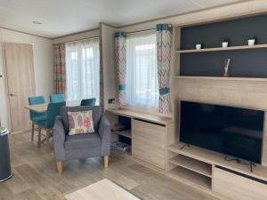 Televiisor ja/või meelelahutuskeskus majutusasutuses Paradise Palms - 35 Lancaster Crescent