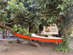 a small boat sitting under a tree at Casa Susegado in Panaji