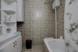 a bathroom with a shower and a toilet and a sink at EcoFit Povlen in Valjevo