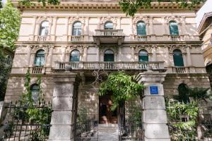 an old building with a gate in front of it at Peacock Apartments Split in Split