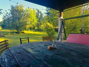 a wooden table with a bowl on top of it at EcoFit Povlen in Valjevo