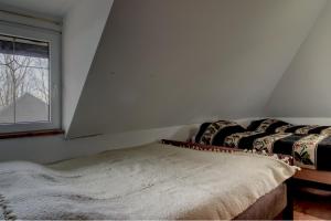a room with two beds and a window at EcoFit Povlen in Valjevo