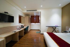 TV a/nebo společenská místnost v ubytování Open Hotel by Olive - Langford Suites
