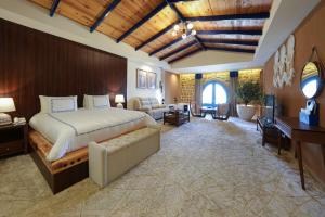 a large bedroom with a bed and a desk at venecia Resort Fayoum in Al Ḩammām +54 photos