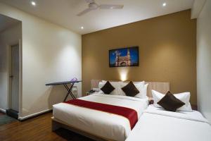 Postel nebo postele na pokoji v ubytování Open Hotel by Olive - Langford Suites + 27 fotografií