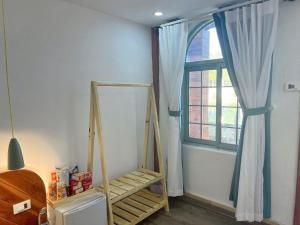 Tempat tidur dalam kamar di Green Town Mộc Châu