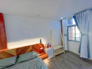 Tempat tidur dalam kamar di Green Town Mộc Châu